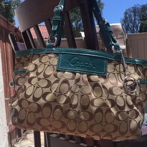 Coach zipper purse in turquoise and tan